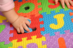 Autistic child playing with puzzle