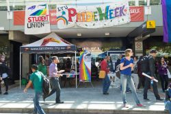 front of library at bundoor la trobe with pride week signs and students interacting