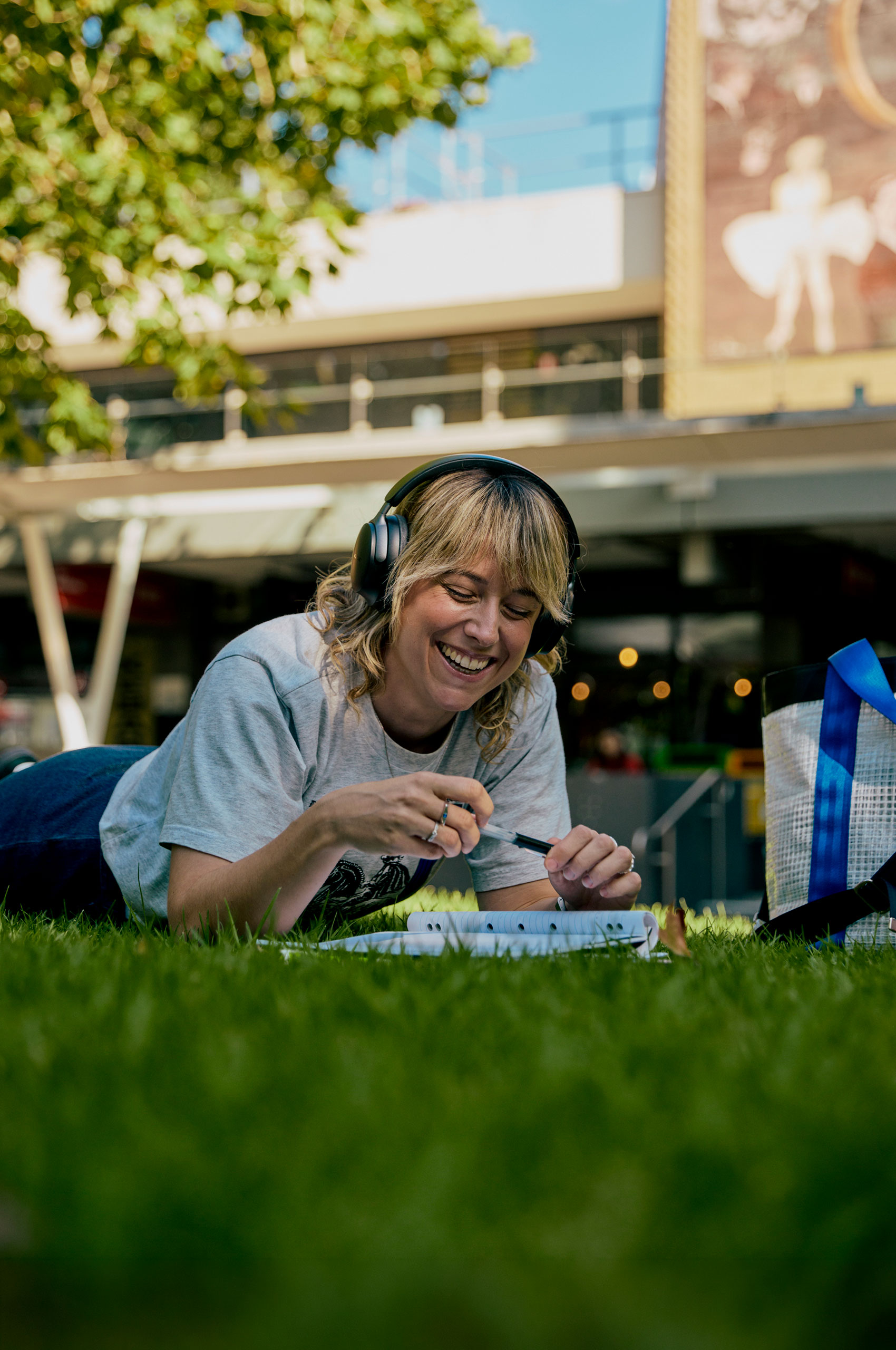 Image of student laying on grass