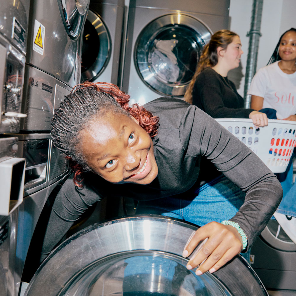 Image of student doing laundry