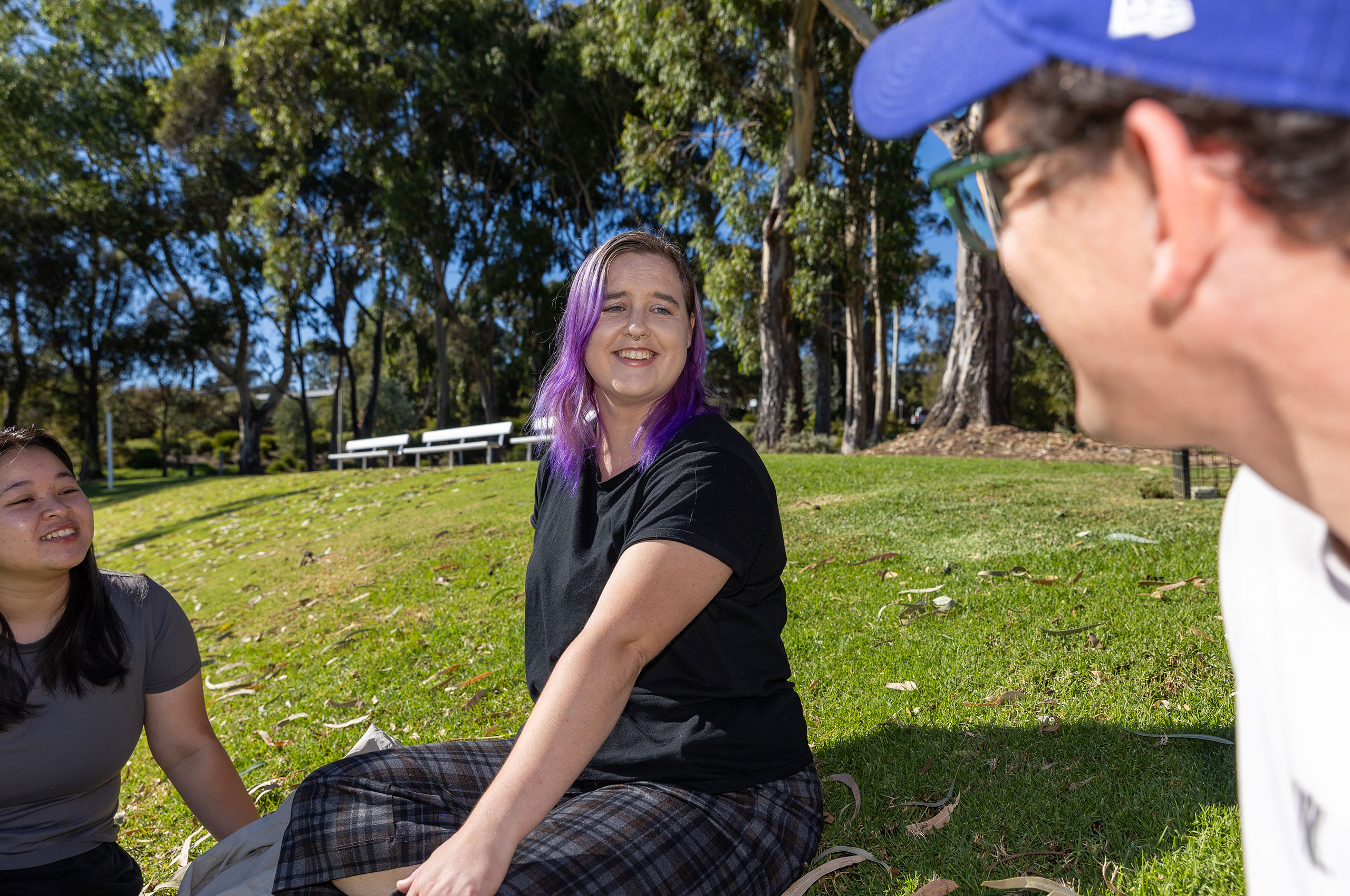 Image of students sitting on Bendigo campus lawn