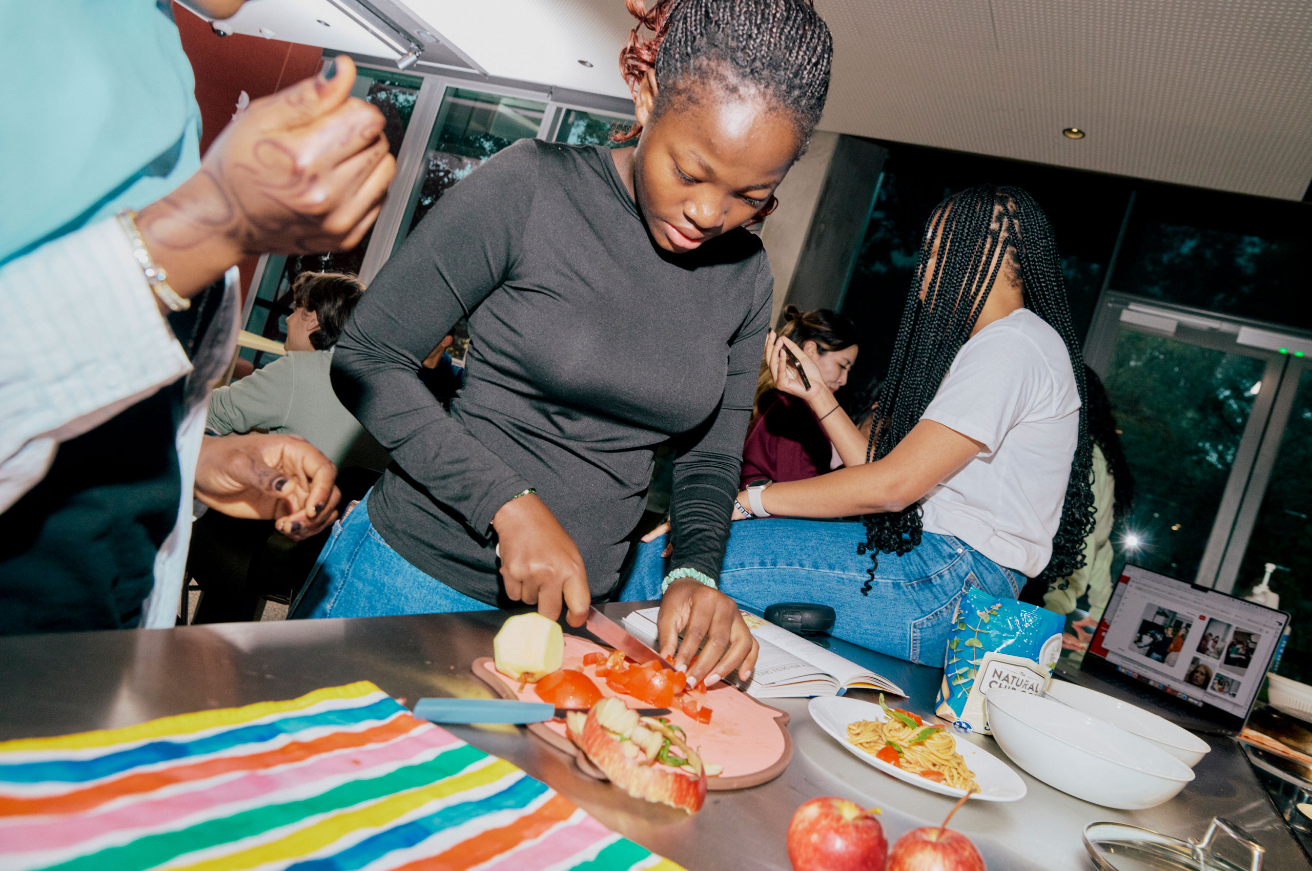 Image of student cutting up fruit