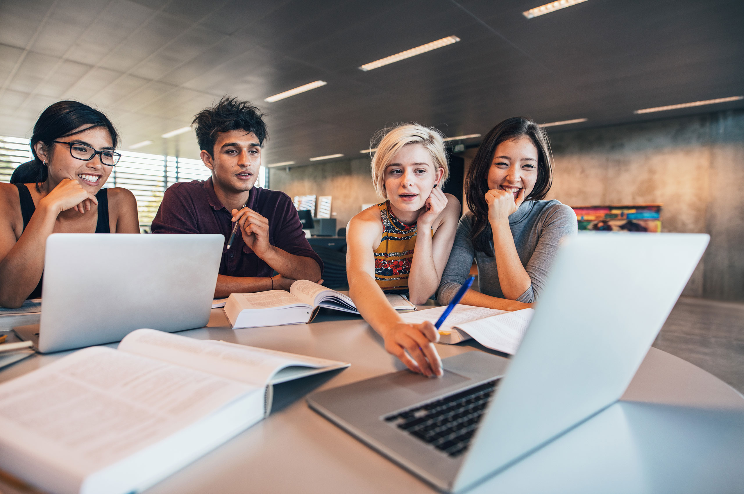 Image of students looking at laptop