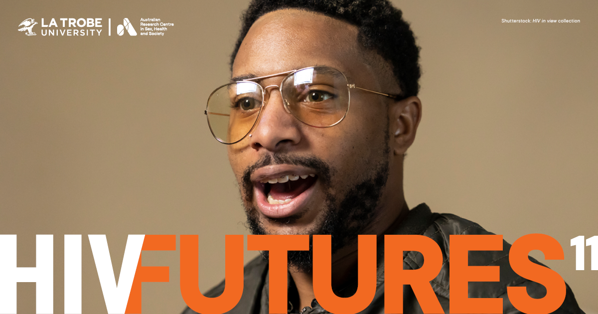 A man with short dark hair, beard, tinted aviator glasses and a diamond nose stud, talking to the camera, with text 'HIV FUTURES 11'