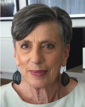 Headshot of Professor Doreen Rosenthal, a person with short sideswept salt-and-pepper hair, a light green top and black leaf-shaped earrings