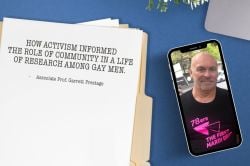 Top-down image of a blue desk top, with a phone showing a picture of Garrett Prestage in a '78ers: the first Mardi Gras' T-shirt, alongside a sheet of paper on a manila folder titled 'How activism informed the role of community in a life of research among gay men'