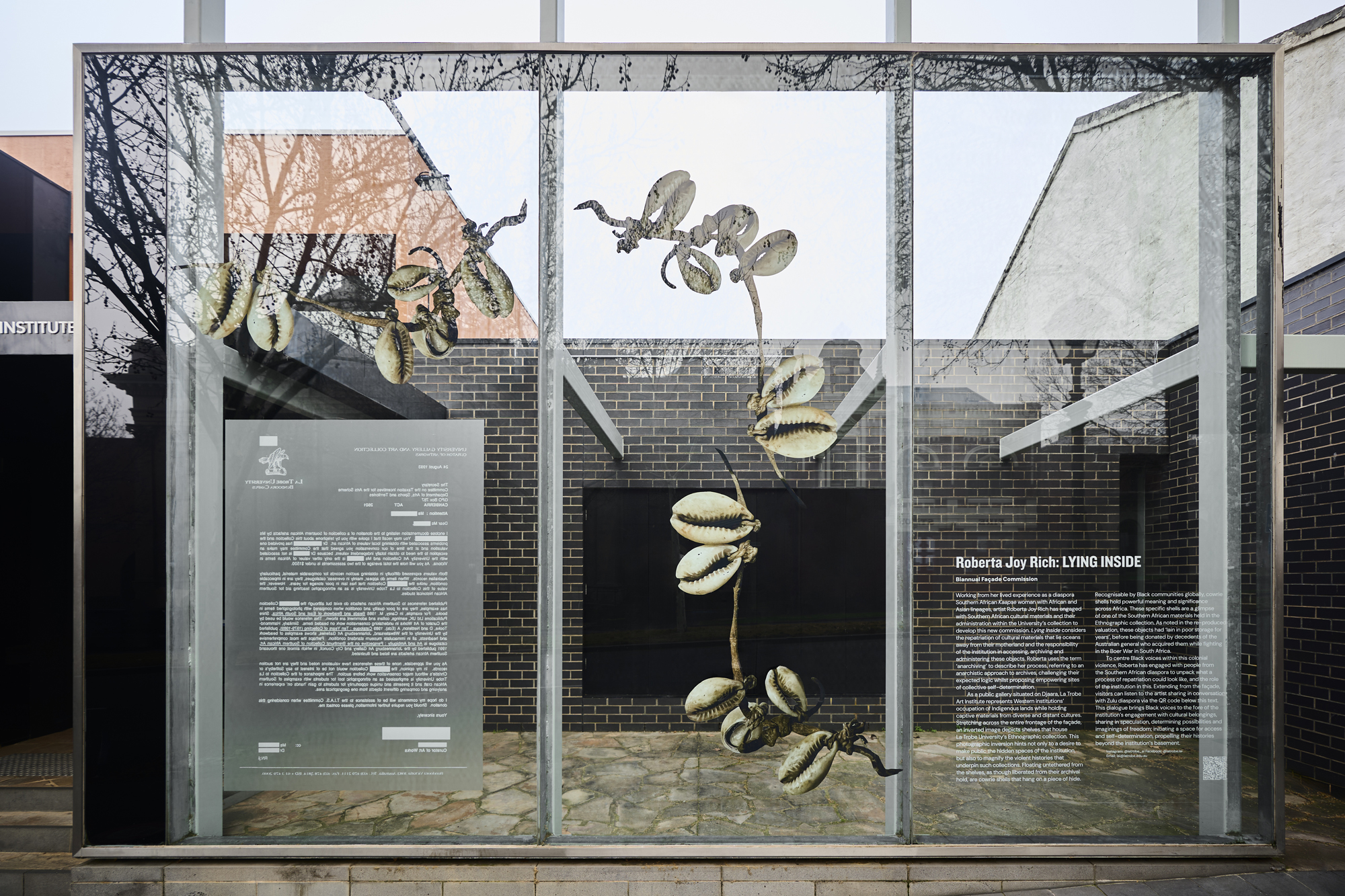 photograph of installation on glass facade of La Trobe Art Institute