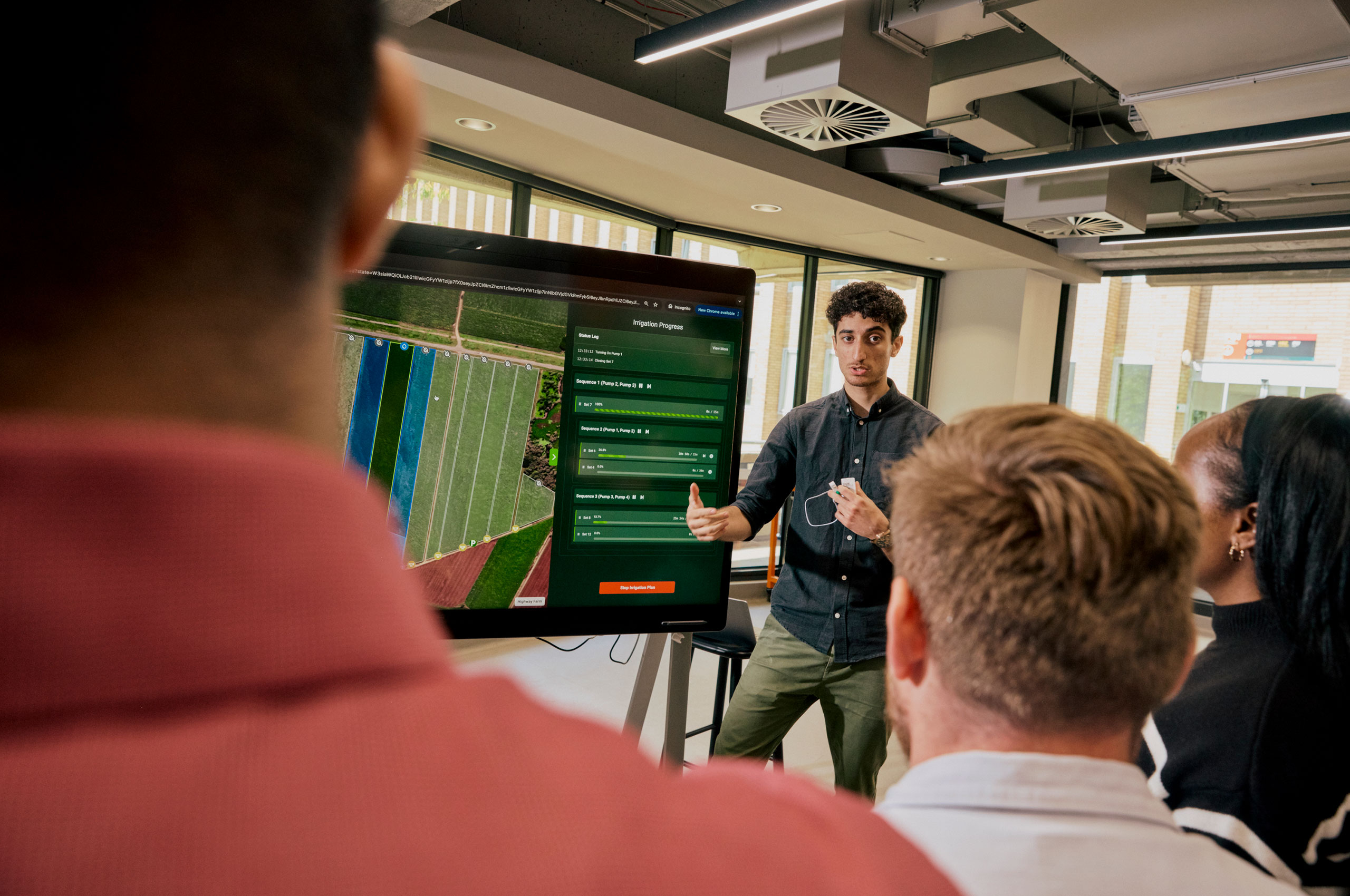 Student presenting with a screen