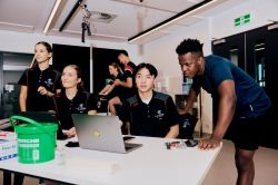 Sport and exercise science students working together in a university lab.