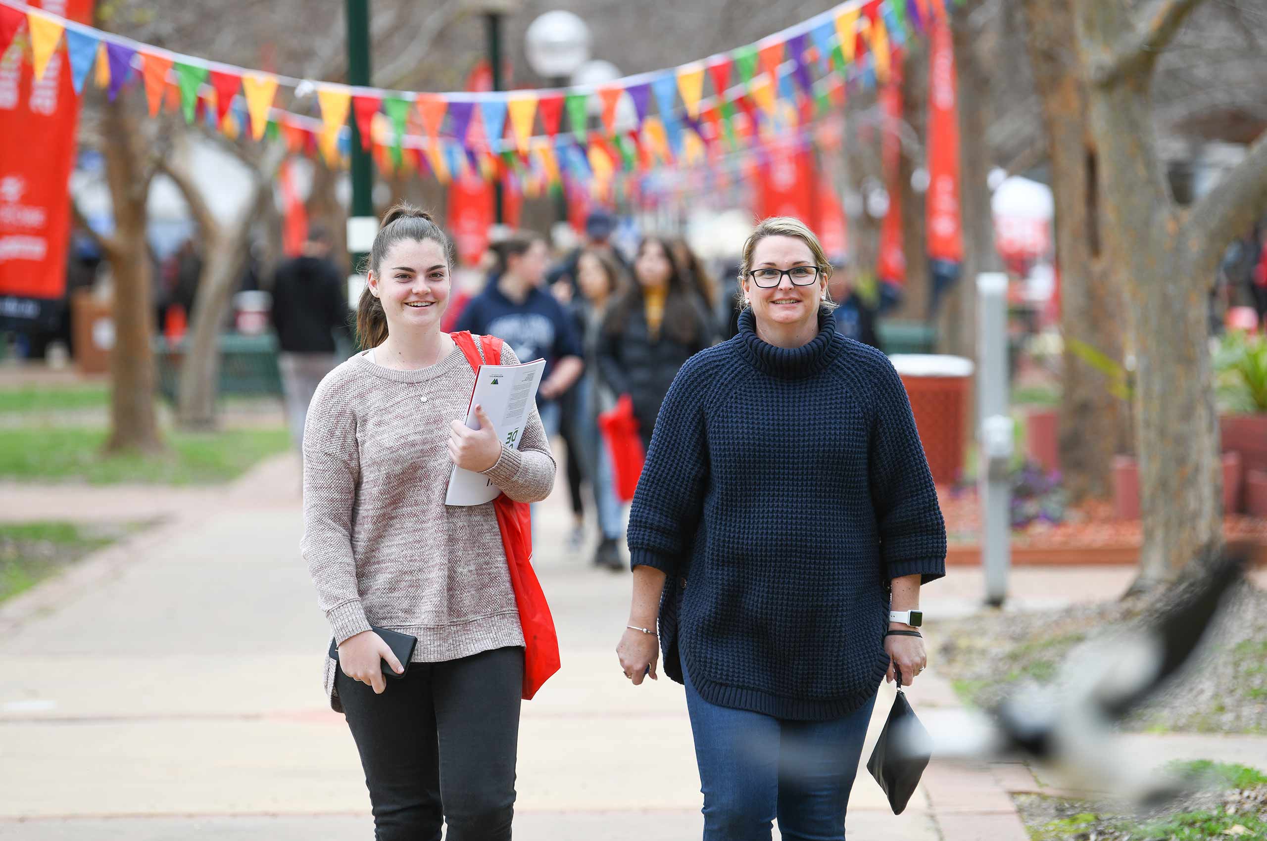 Female student and parent attending a campus event.