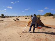 Caroline Spry collects data at Lake Mungo for her PhD research project on stone tool artefacts.