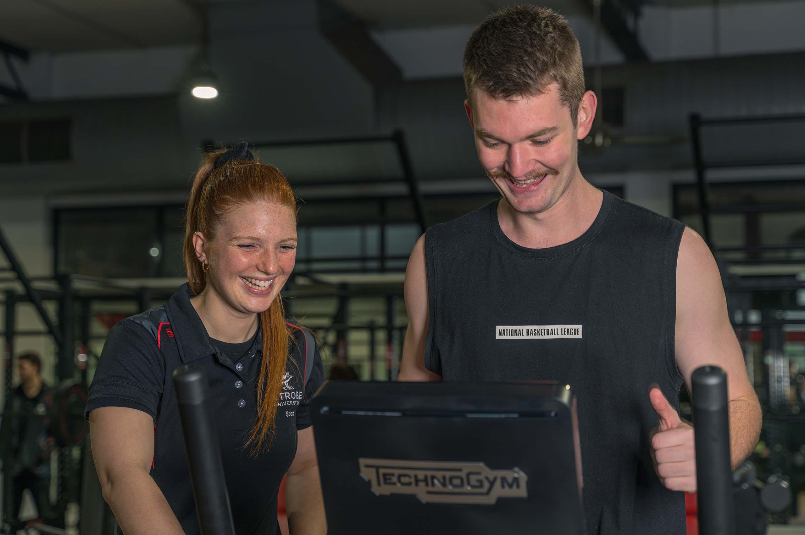 Indoor Sports Centre Gym - Female Trainer and Male Member.jpg