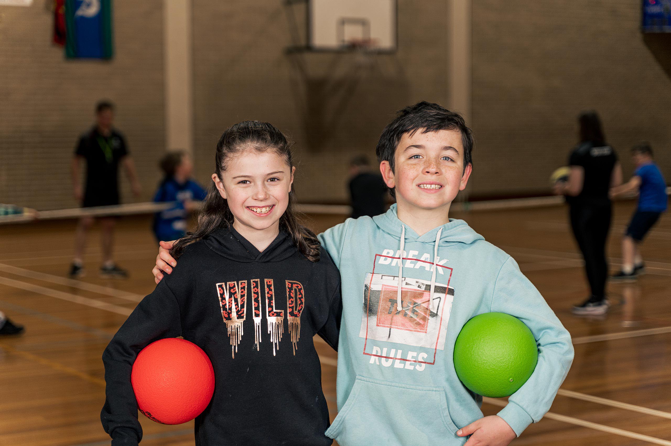 Kids smiling after a dodge ball game