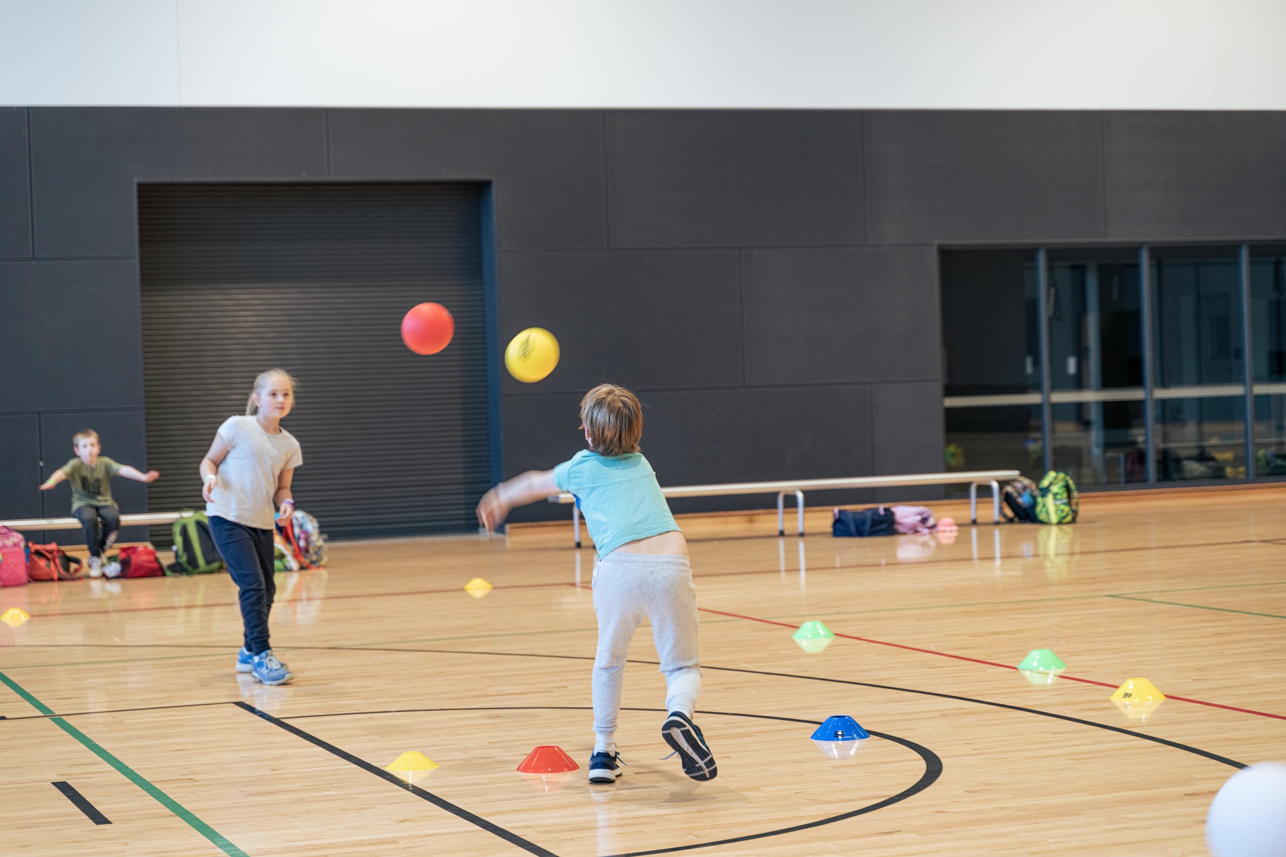 Kids practicing balls skills in our sports stadium