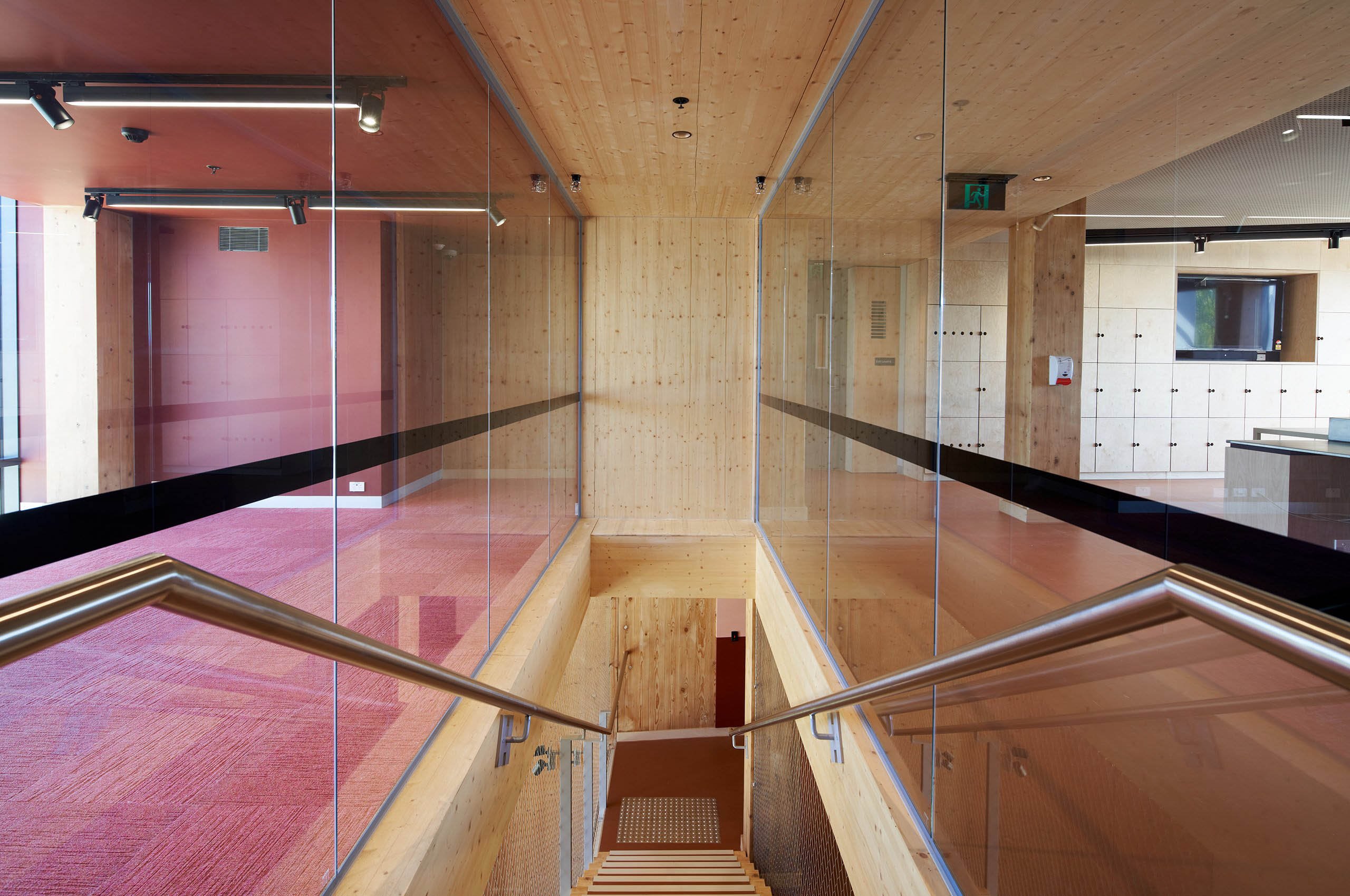 The top of the staircase with the exposed cross-laminated timber on show.
