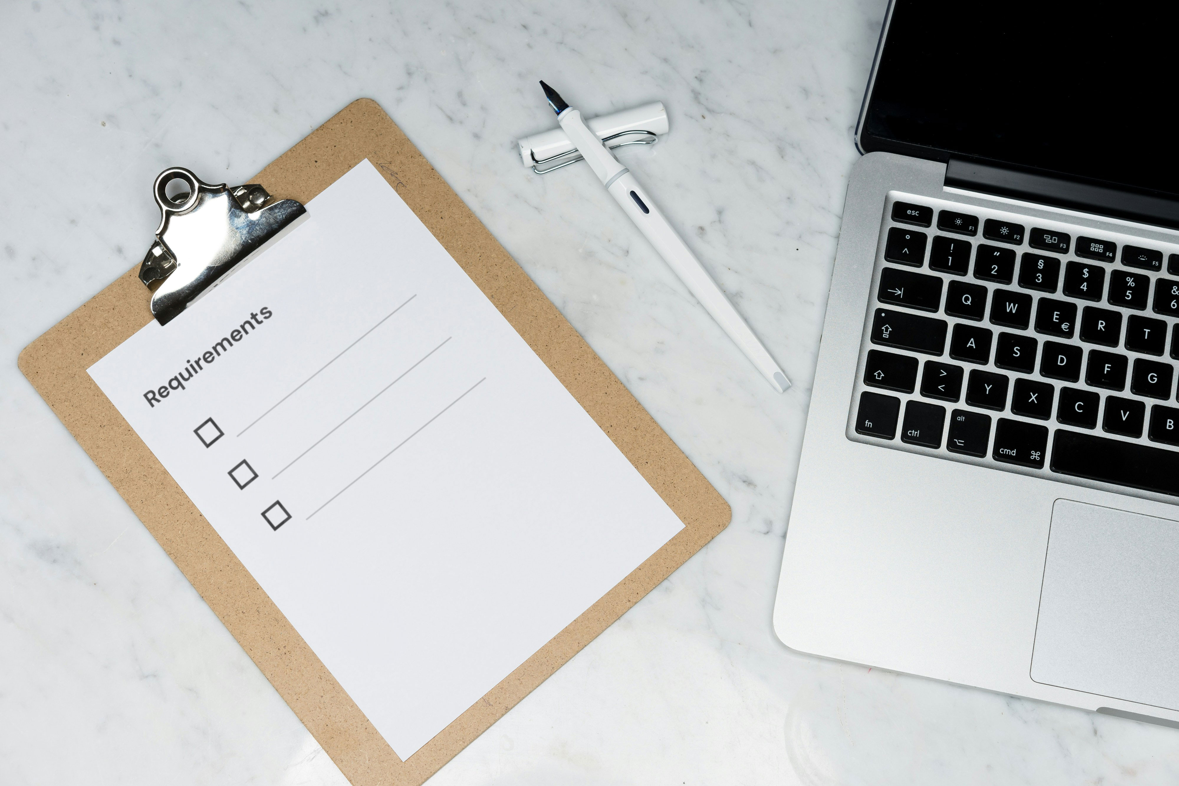 A clipboard showing a blank list titled Requirements