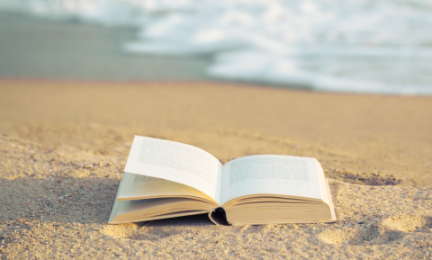 A book opened on the sand