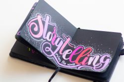 An open book showing the text 'Storytelling'