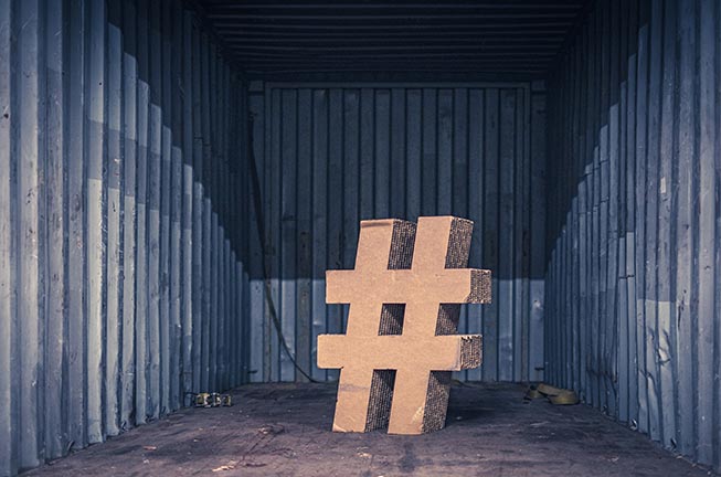 Brown ampersand concrete stature inside an intermodal container by Jan Baborák.