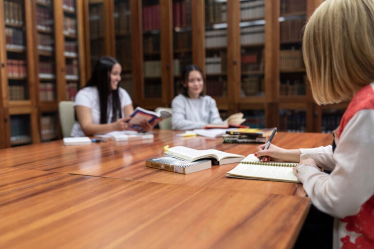 Students studying together and writing notes