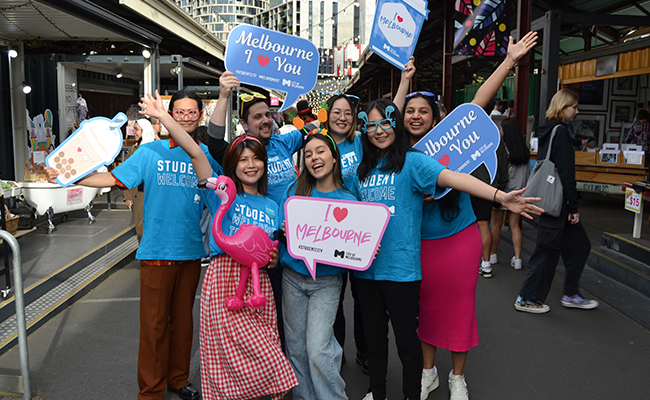 WordPress Article (650 x 400)_image 2 Students wearing blue t shirts happily posing for a photo in the City of Melbourne