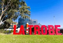 Red La Trobe sign in front of the Bendigo campus.