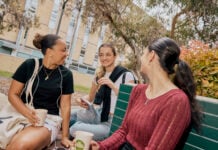 Group of three students in conversation