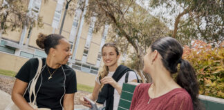 Group of three students in conversation