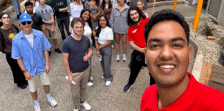 Student intern Akshad taking a selfie with his La Trobe uni peers