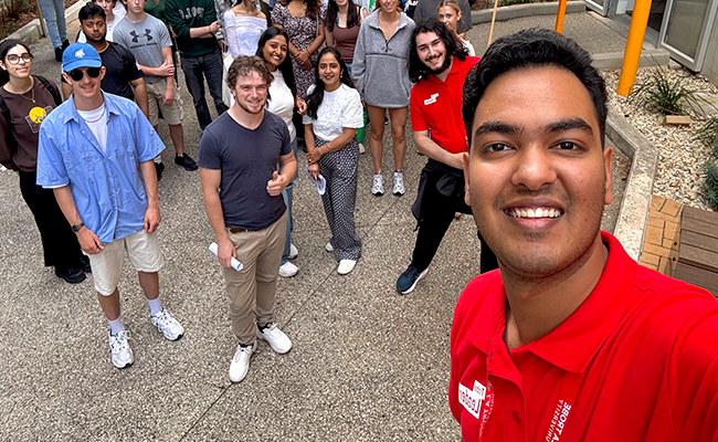 Student intern Akshad taking a selfie with his La Trobe uni peers