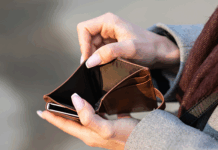 Person opening an empty wallet.