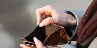 Person opening an empty wallet.