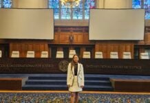 JD student Nicole at standing in the International Court of Justice