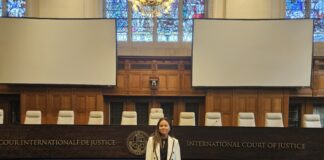 JD student Nicole at standing in the International Court of Justice