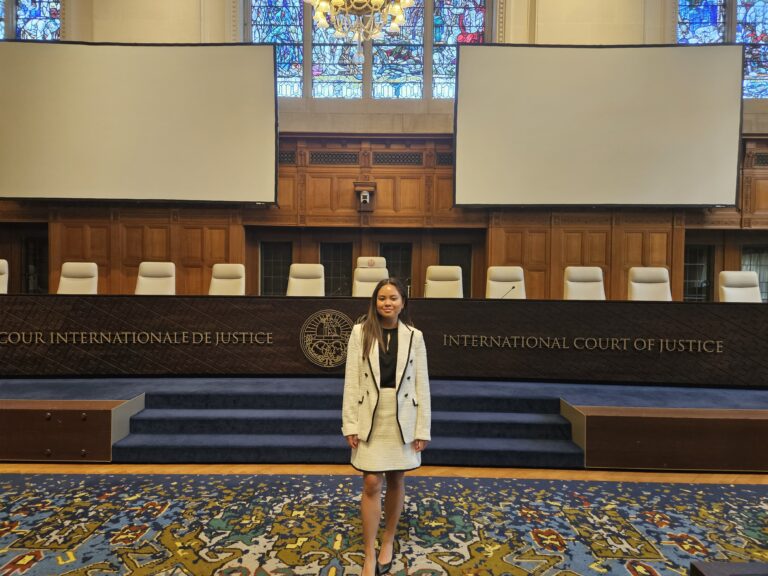 JD student Nicole at standing in the International Court of Justice