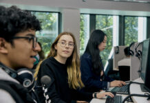 Three students at a computer