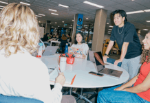 A group of students sitting round a table in the Bundoora library