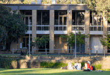 Students sitting on Simpsons lawn