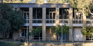 Students sitting on Simpsons lawn