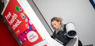 A student using the Sisu health station