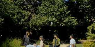 Students sitting at the International Garden at the Bundoora campus