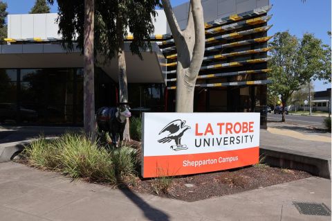 La trobe University Shepparton Campus, image of buildings with campus signage and a cow sculpture