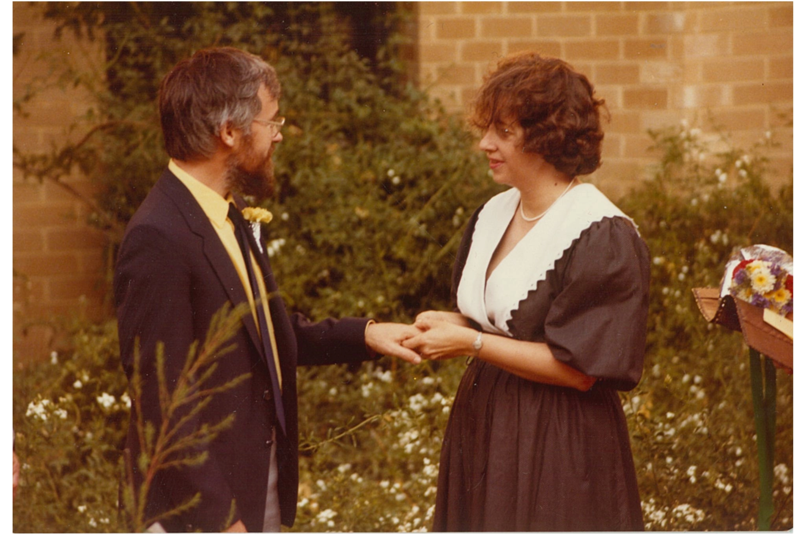 Roger Douglas and Robin Burns at their on-campus wedding behind the School of Education