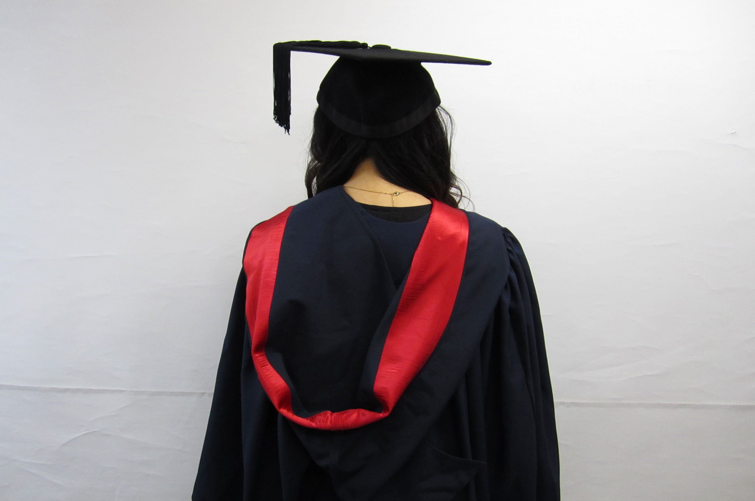 back of bachelor (honours) degree gown, deep red silk sash in hood like shape hanging over back