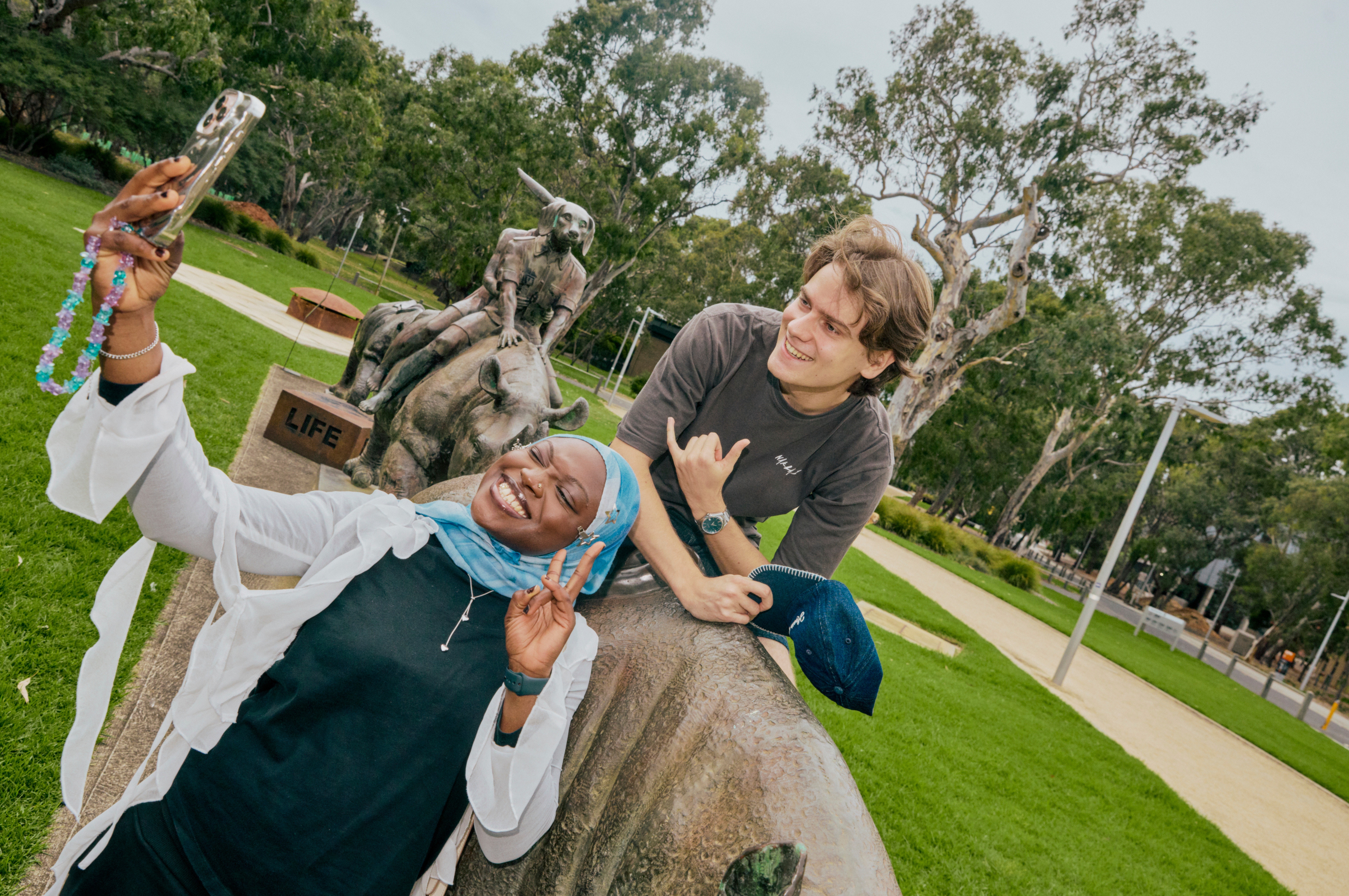 An image of two students taking a selfie together