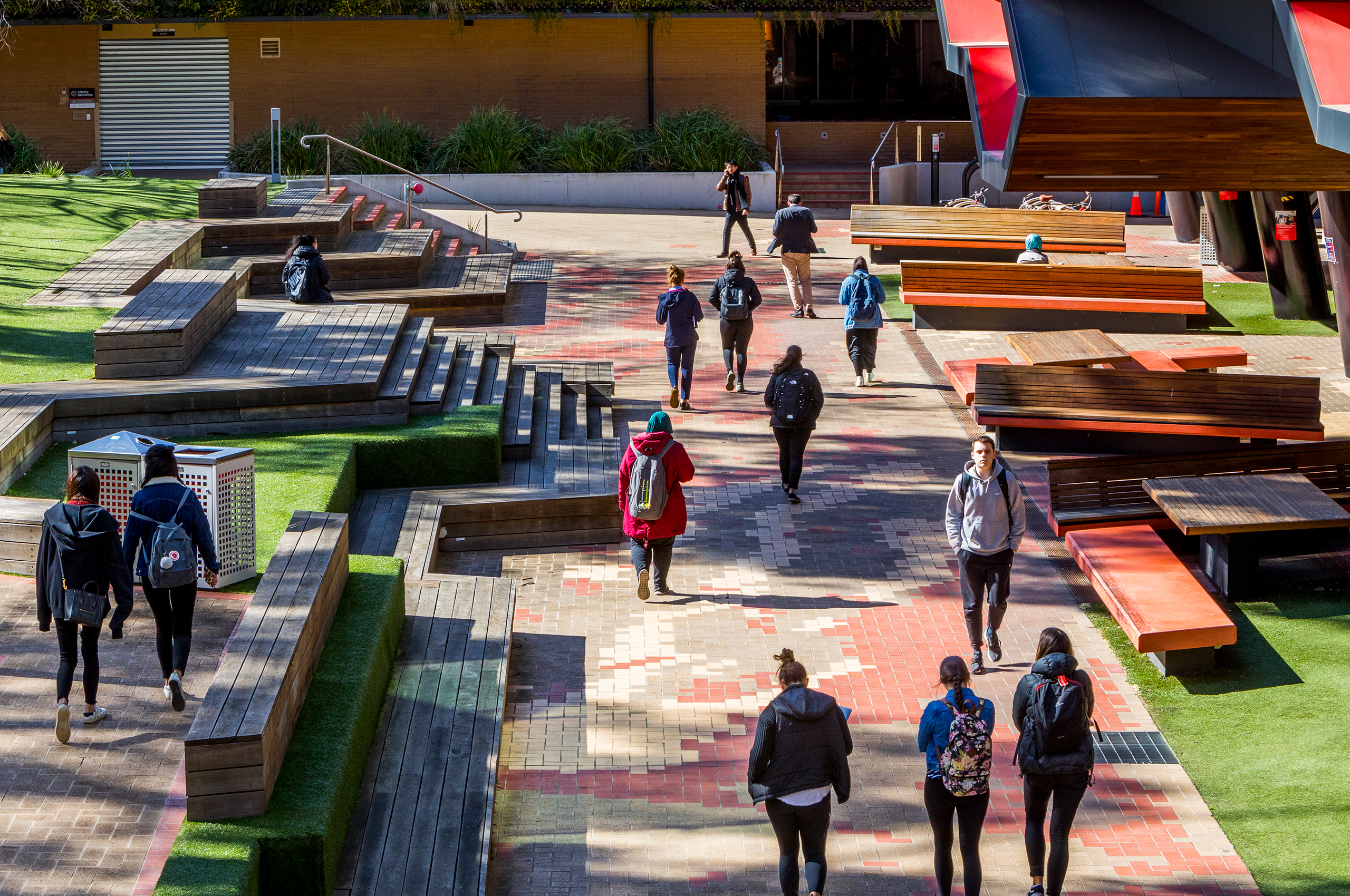 Student walking down LIMS path