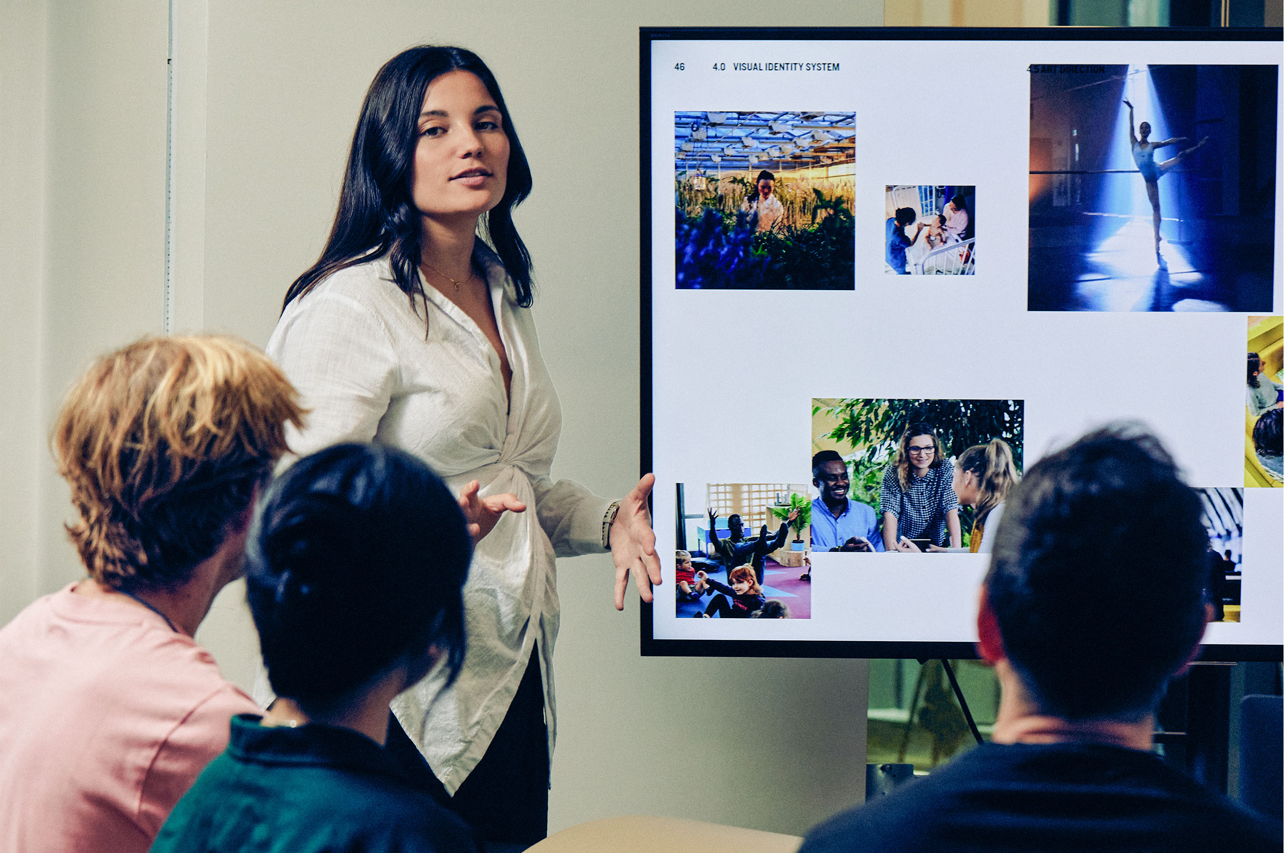 Female teacher with a group of students.