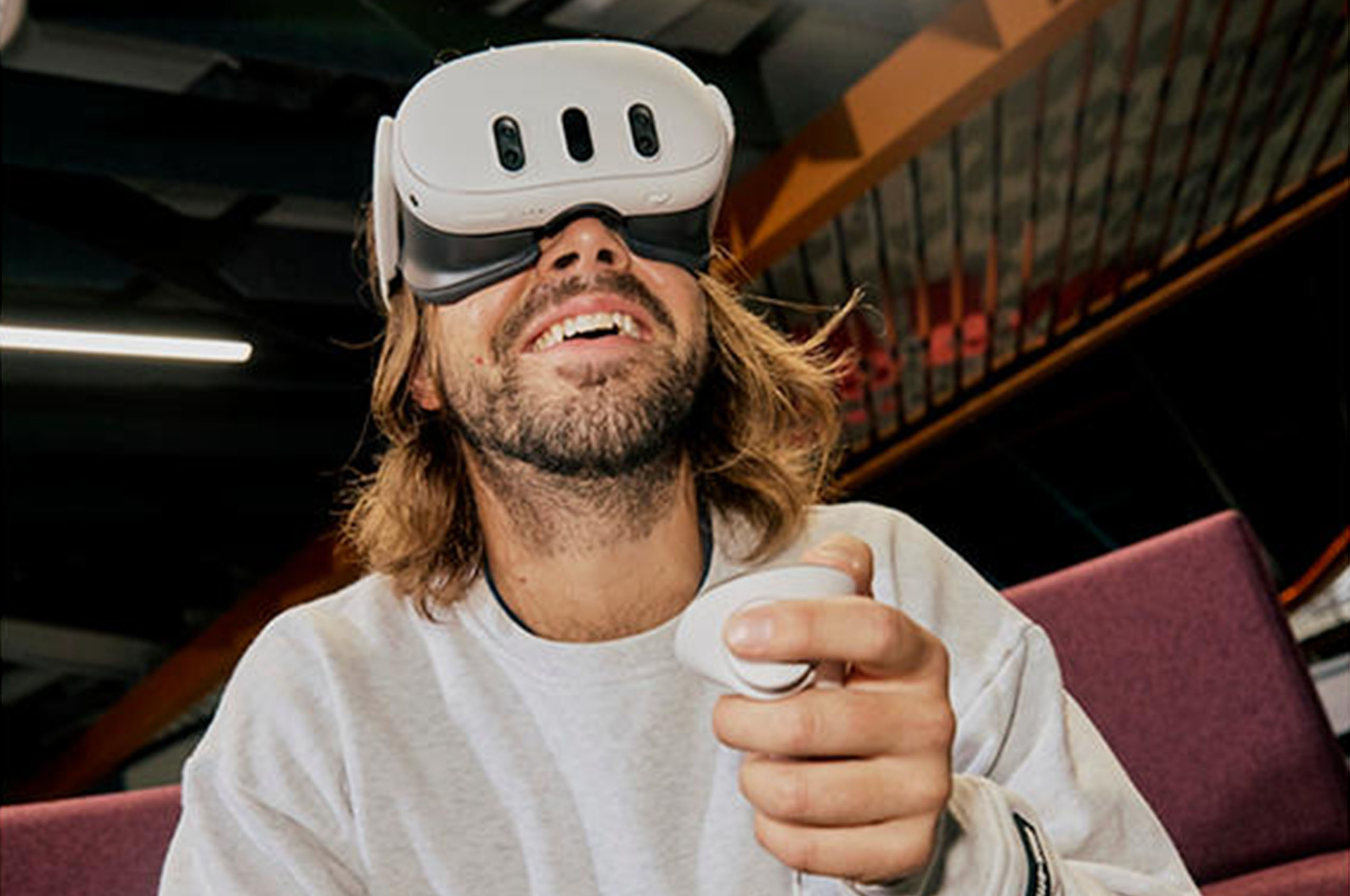 A male wearing VR goggles.